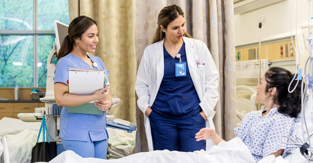 patient speaking with care team in hospital